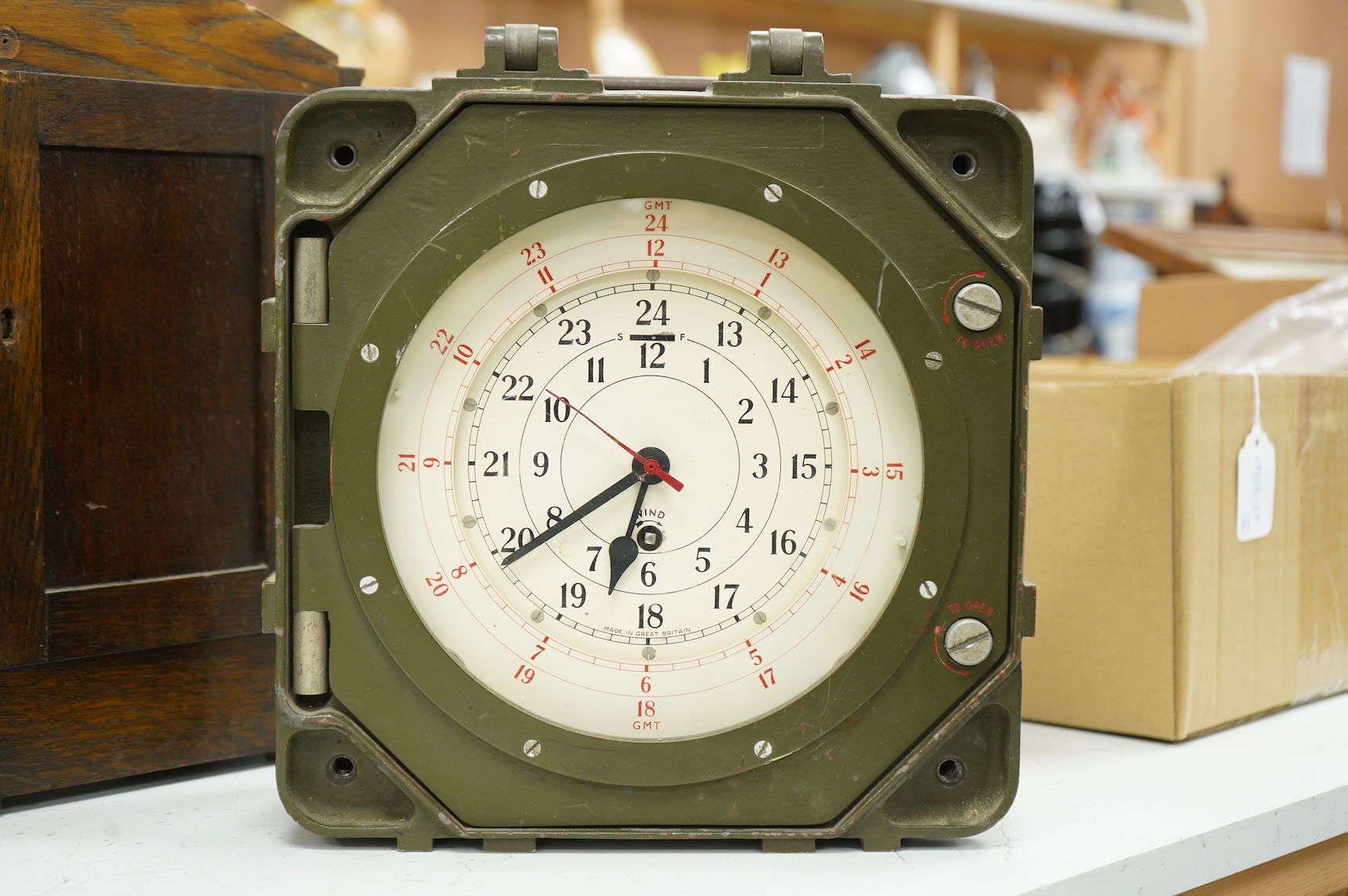 A British military Astral Smiths eight day signal clock, housed in a metal alloy case with detachable cover, 29 x 29 x 12cm